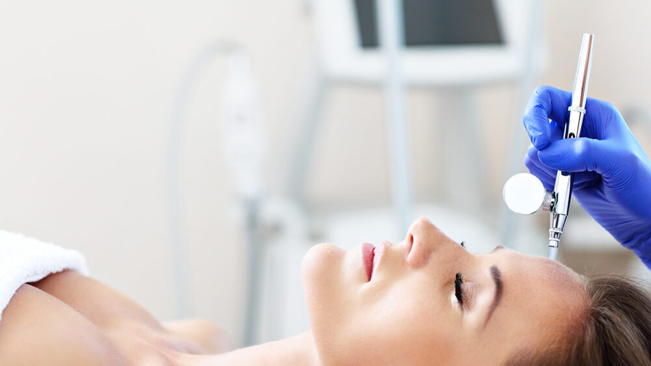 Picture of woman having facial treatment in beauty salon